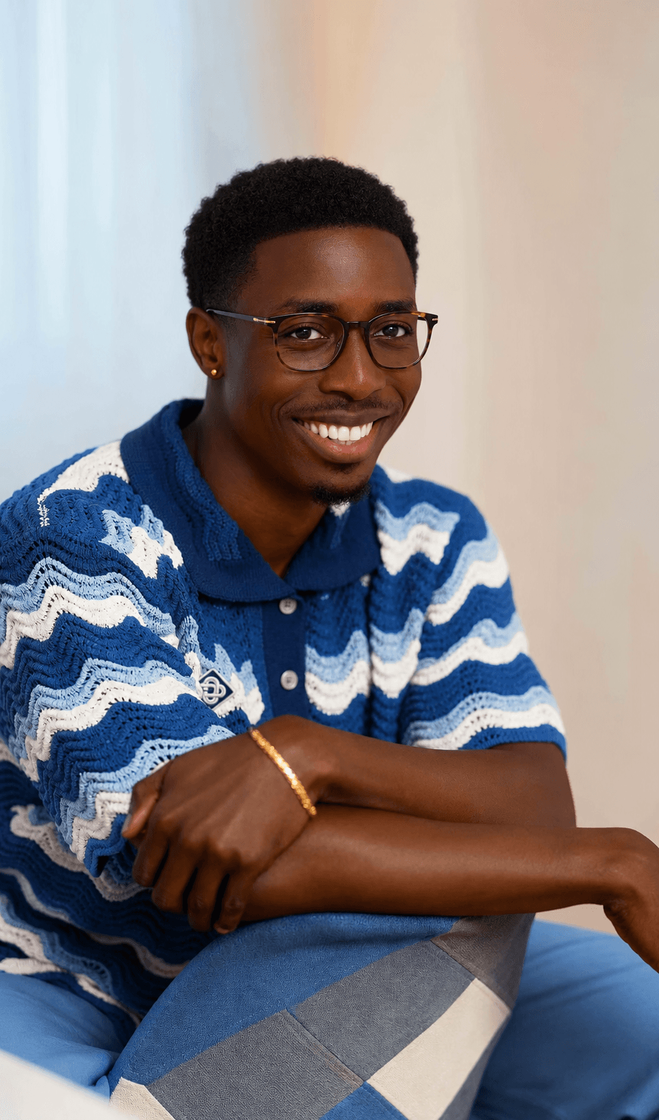Smiling man in yellow shirt